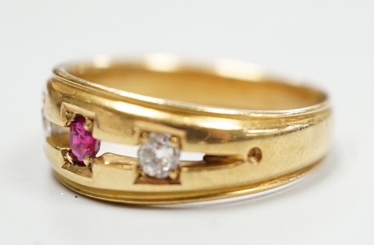 A late Victorian 18ct gold, ruby and diamond set three stone ring, size K/L, gross weight 4 grams.